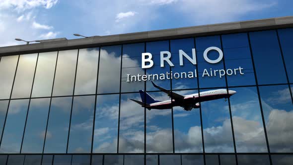 Airplane landing at Brno Czech airport mirrored in terminal