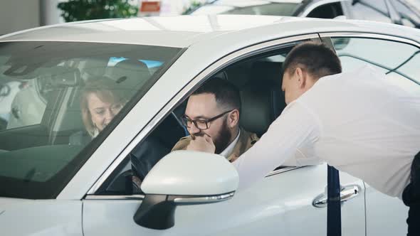 A Married Couple in a Large Car Dealership