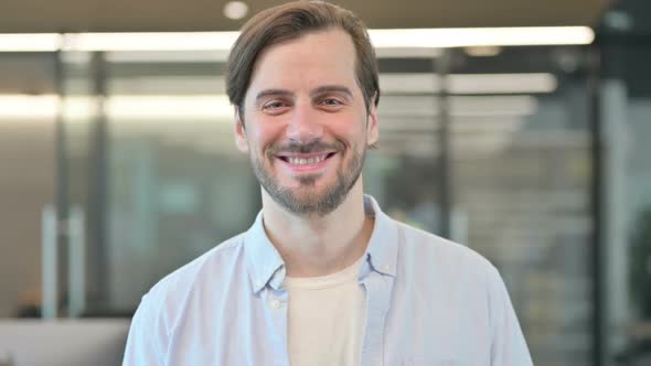 Mature Adult Man Smiling at Camera