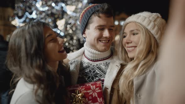 Three Friends Taking Selfie at Xmas Night