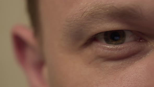 Closeup of a Male Eye Light Gray Camera Movement Reflection of the Monitor in the Eye