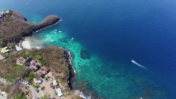 Island in Bali, with Sparkling Waters at Beach and Trees Surrounding the Aarea