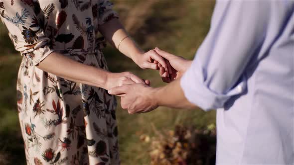 Positive Young Happy Loving Couple Holding Hands