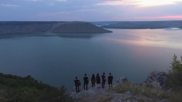 Band admiring the view from a cliff