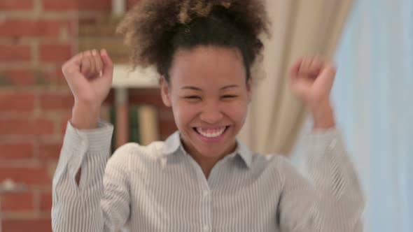 Portrait of African American Woman Celebrating Success