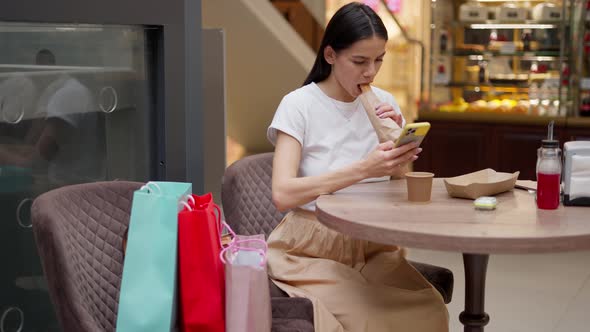 Brunette Woman Having Coffee Break After Exhausting Shopping Day in Mall