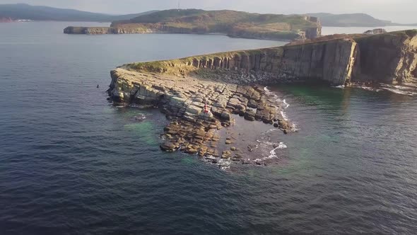 Drone View of a Beautiful Peninsula Tobizina with Vertical Cliffs at Sunset