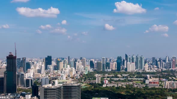 Bangkok business district city center above Asok area, with cloud pass over, zoom in – Time Lapse