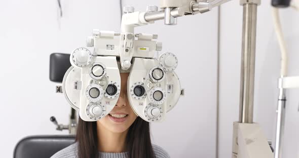 Woman undergo eye exam