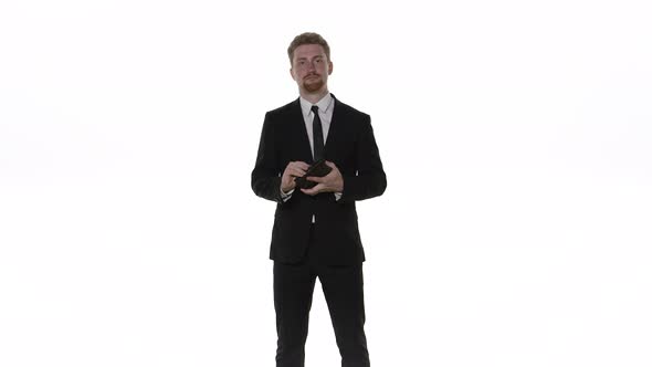 Businessman Takes Out a Wallet on a White Background