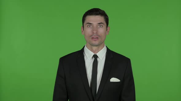 Shocked Young Businessman in Awe Chroma Key