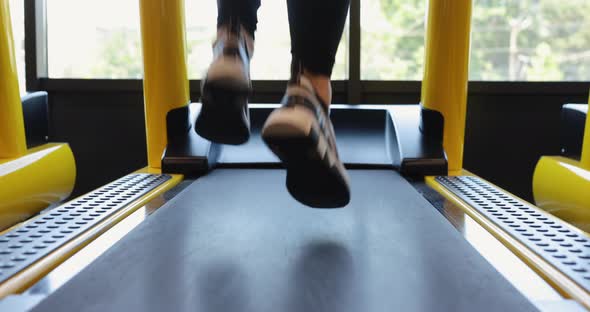 Legs Running on Treadmill in a Gym
