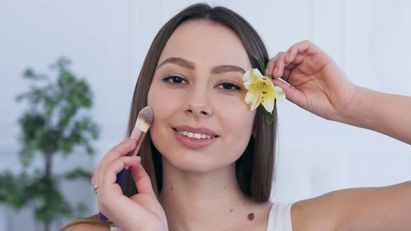 Beautiful Caucasian Woman with Flower in the Hair