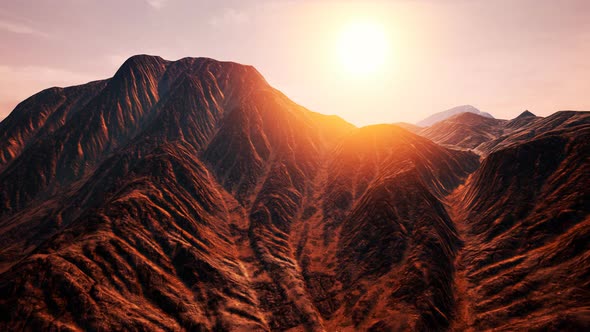 Sun Rays Over Mountains in a Valley alt