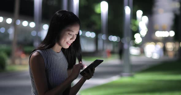 Business Woman Use of Mobile Phone in City 