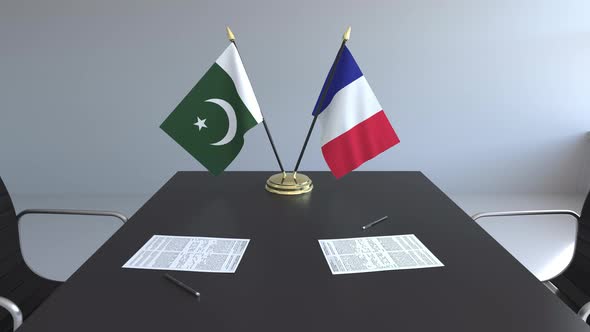 Flags of Pakistan and France on the Table alt