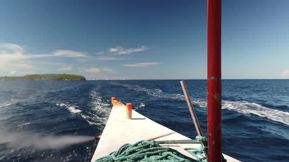 Rear passenger view on travel boat leaving island