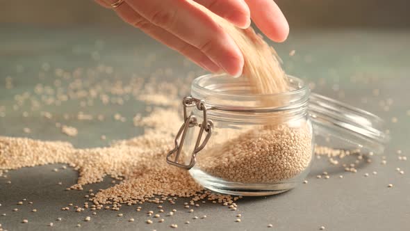 White raw quinoa in glass jar