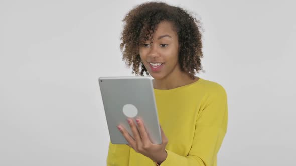 Video Call on Tablet By Young African Woman on White Background