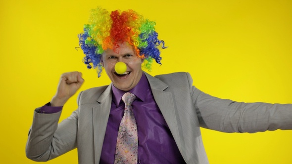 Clown Businessman Entrepreneur in Wig Dancing, Celebrate, Making Silly Faces