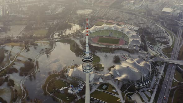 Aerial shot over Olympiaturm tower and Olympiapark in Munich Germany