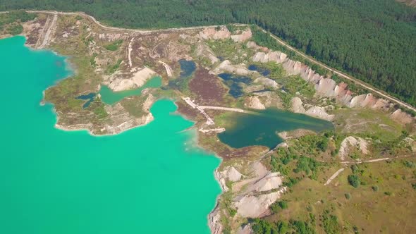 An artificial lake in chalk quarry. view from drone. Turquoise water background