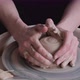 A woman works on a potter's wheel - VideoHive Item for Sale
