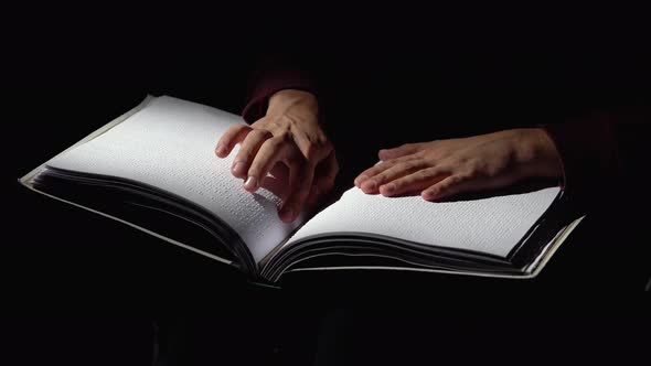 Reading Braille the Man Learns To Read Braille in Dark Studio. Close Up