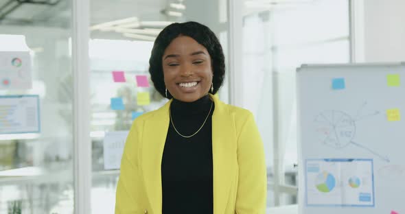 Businesswoman in Stylish clothes Standing in front of Camera in the Middle of Modern Office Room