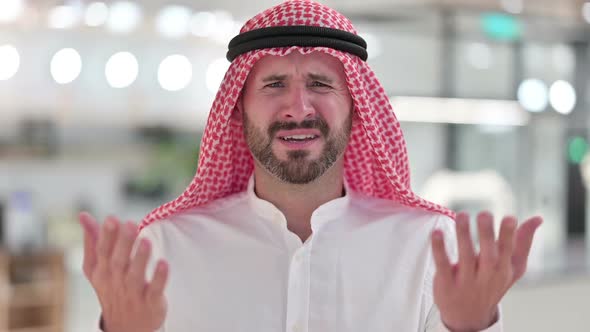 Disappointed Arab Businessman Reacting to Loss Failure