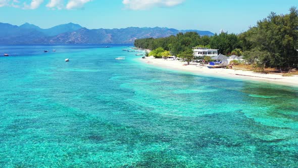 Wide overhead island view of a paradise sunny white sand beach and turquoise sea background in high 