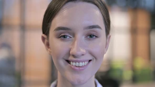 Close Up of Smiling Young Woman Face