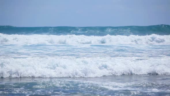 Beautiful Blue Waves with White Foam on the Ocean Shore