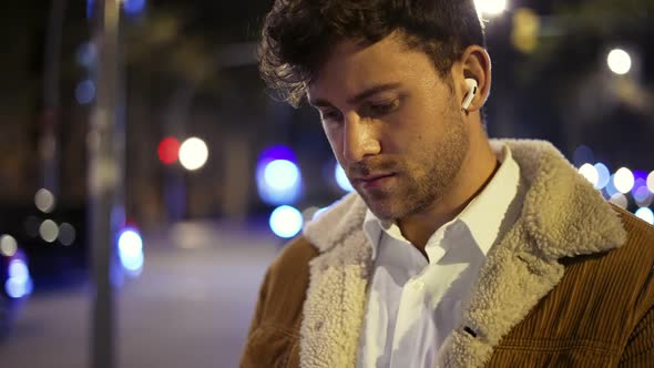 Man Listening to Music on Street