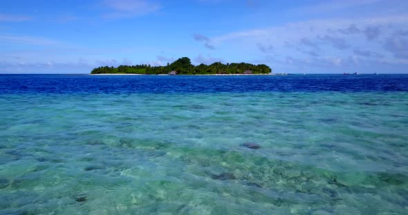 Tropical drone clean view of a white sandy paradise beach and aqua blue ocean background in colourfu