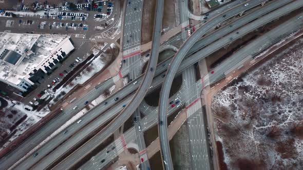 Aerial Flyover Traffic Jam Interchange Road in Winter Evening Drone Shot Top Down View Roadway