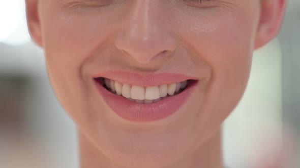 Close Up of Smiling Mouth of Young Woman