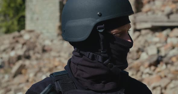 A Soldier in a Helmet Looks Around
