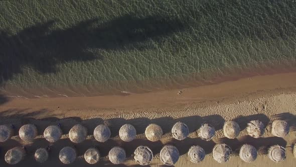  - Aerial Vacation Scene of Sea and Beach with Straw Umbrellas