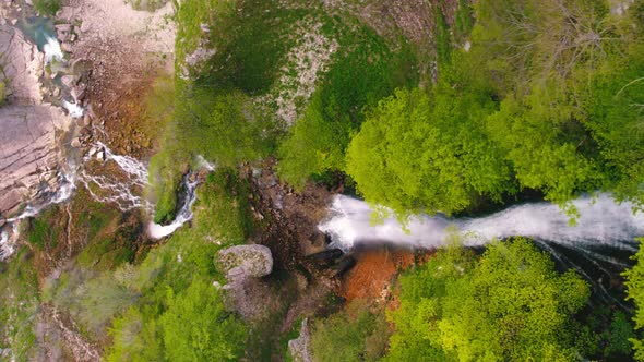 Birds Eye Shot of Kinchkha Waterfall and River on Okatse Canyon Vertical Aerial Video