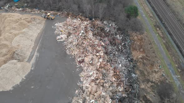 Landfill Tractor at City Dump Forward Aerial Zooming In