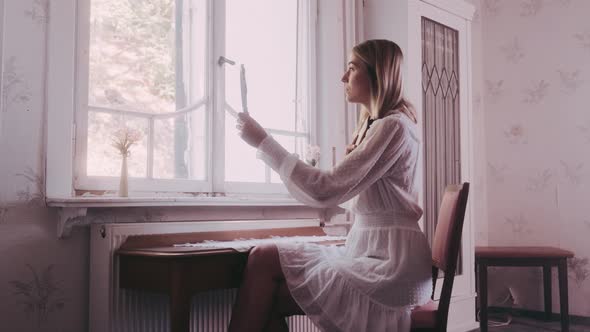 Woman in an old vintage Hotel