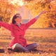 Woman in Red Cloak Throwing Autumn Leaves in Park - VideoHive Item for Sale