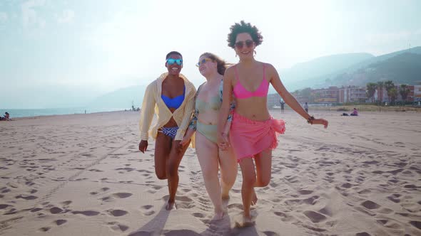 multiethnic young women having fun on the beach