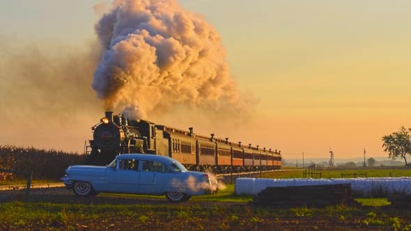 Steam Passenger Train Approaching With a Full Head of Steam at Sunrise