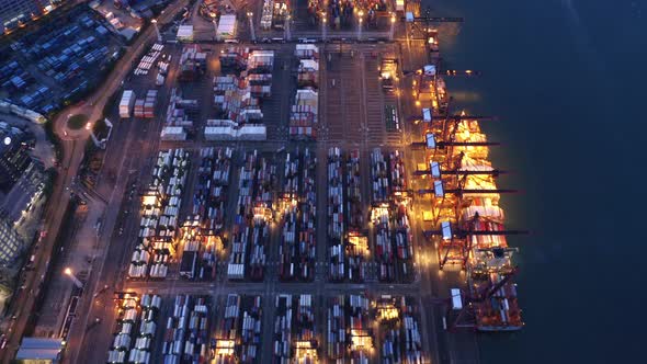 Aerial top view of container in logistics or shipping business at Victoria Harbour, Hong Kong.