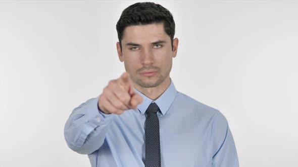 Businessman Pointing Toward Camera on White Background