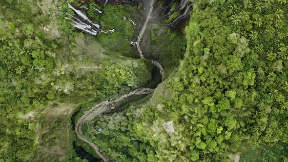 Drone Over River In Forest To Tumpak Sewu Waterfalls