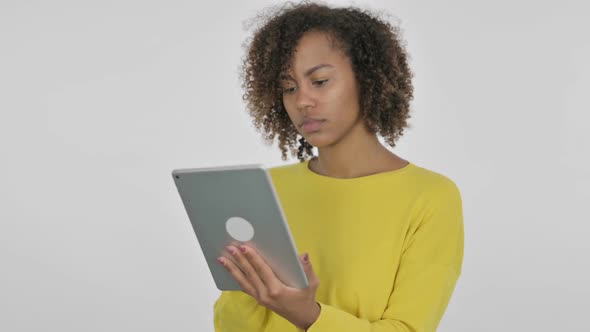 Young African Woman Using Digital Tablet on White Background