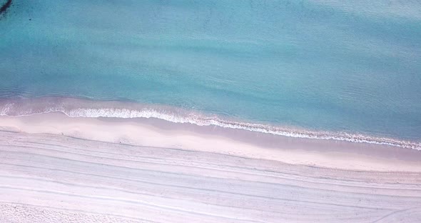 Tropical white sand amazing beach view with blue ocean waves on the shore. Concept of summer